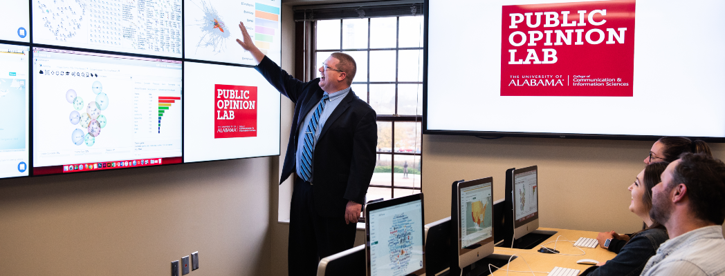 Dr. Hayes explains research results to a group of students